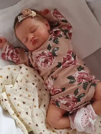 Slapende  babyborn pop meisje Rosalie met bruin haar
